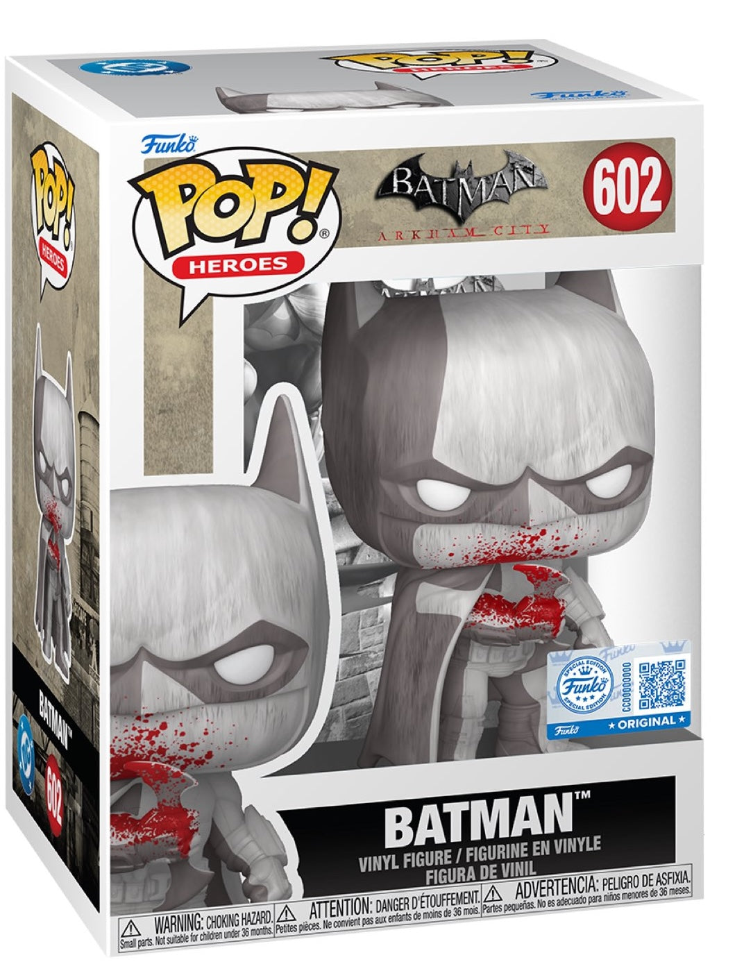A Funko Pop! Heroes figure of Batman from Arkham City. The figure is grayscale with bright red blood splatters on his mouth and chest. The box displays the character in the same pose with the number 602.