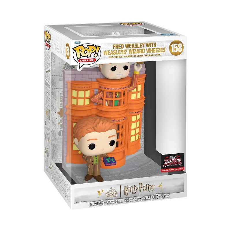 Funko Pop! Deluxe figure of Fred Weasley from Harry Potter, with Weasley's Wizard Wheezes packaging, collectible toy by Shak's Pop Shop.