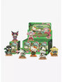 Six collectible Mighty Jaxx Hello Kitty and Friends Mokubi Fukusou blind boxes, featuring colorful character designs in a case.