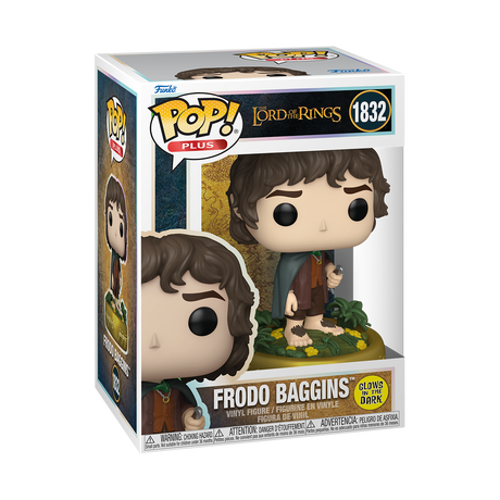 A Funko Pop! Plus figure of Frodo Baggins from The Lord of the Rings, with brown curly hair, a green cape, and holding a ring. He stands on a base with yellow flowers and glows in the dark.