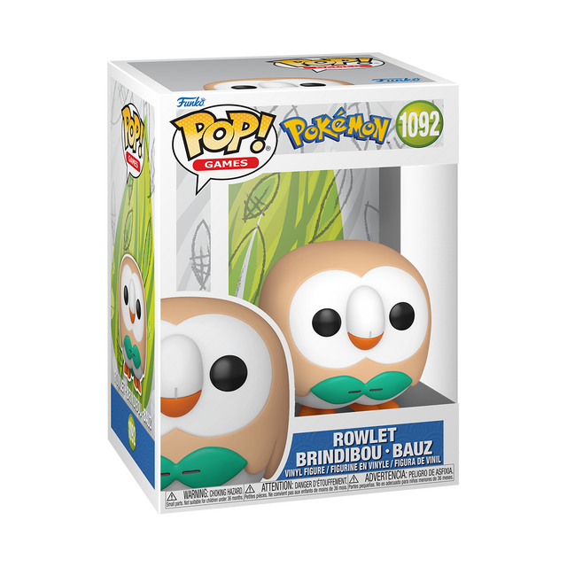 A Funko Pop! Games figure of Pokémon Rowlet, an owl-like creature with a light brown body, white face, green bow tie, and orange beak. The box is white and light blue with a green leaf pattern.