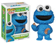 Funko Pop! figure of Cookie Monster from Sesame Street, collectible vinyl toy by Shak's Pop Shop, featuring Cookie Monster with cookies.